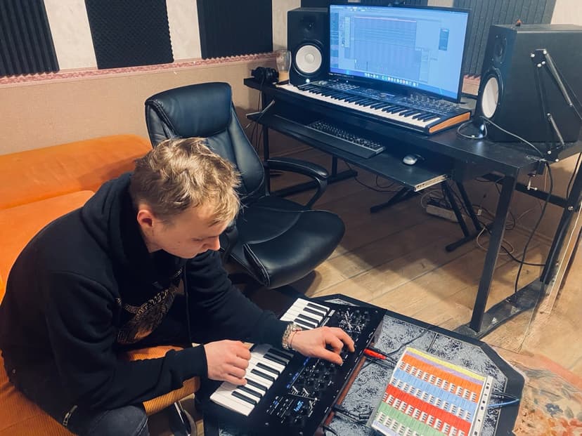 Some guy in studio playing KORG Minilogue XD